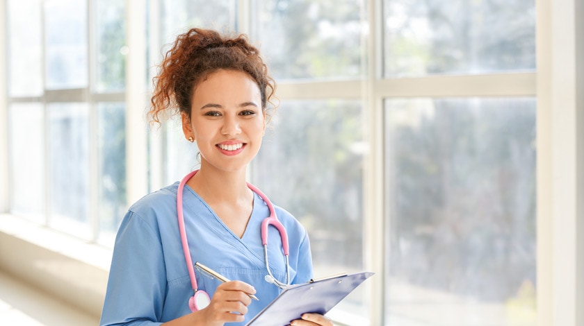 High school nursing program student in scrubs