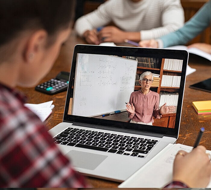Online high school student attents LiveLesson session - Connections Academy