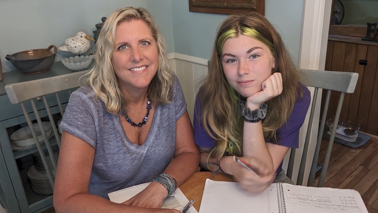 Connections Academy student and her mom studying together at a table 